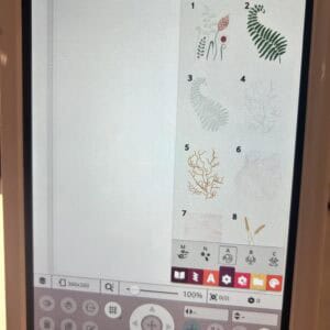 Tablet screen displaying an embroidery motif catalog with numbered botanical designs 1–8 on the right panel, title in Dutch, and UI icons surrounding it.