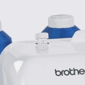 White Brother sewing machine with blue thread spools in the background