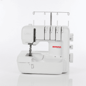 White Bernina L650 serger sewing machine with multiple thread spools on top.