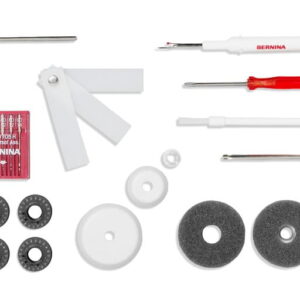 Bernina sewing machine tool kit with screwdrivers, white plastic guides, foam spacers, discs, and small components arranged on a white background